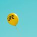 yellow life-printed balloon